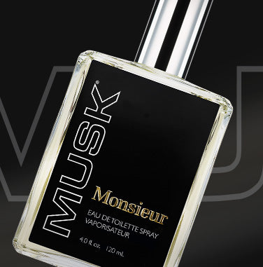Editorial shot: close-up of Bottle of Monsieur Musk eau de toilette spray on a black background.
